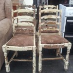 Four matching oak ladder back chairs. Easy to strip back and would make an ideal shabby chic / up-cycle project £50